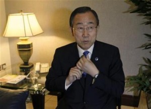 United Nations Secretary-General Ban fixes his tie ahead of an interview with Reuters during his arrival to Dubai from Tehran