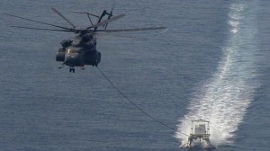 A US helicopter towing a minesweeper in the Persian Gulf