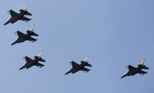 Israeli Air Force F-16 war planes fly in formation over the Mediterranean Sea as part of celebrations for Israel's 65th Independence Day