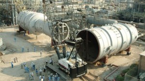 Iranians technicians installing equipment at a refinery