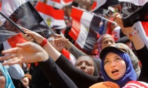 Egyptian protesters shout slogans against President Morsi in Tahrir Square in Cairo