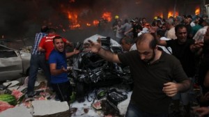 People shout for help after a huge car bomb blast rocks south of Beirut, Lebanon, August 15, 2013.