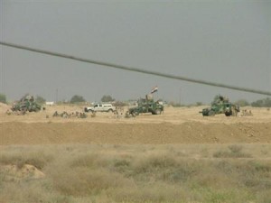 Handout photo from Camp Ashraf shows Iraqi security forces outside the Iranian dissident camp after clashes with residents of the camp in Diyala province