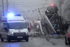 Members of the emergency services work at the site of a bomb blast on a trolleybus in Volgograd
