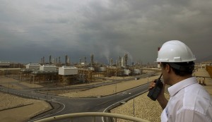 An engineer speaks on his radio at the Phase 4 and Phase 5 gas refineries in Assalouyeh