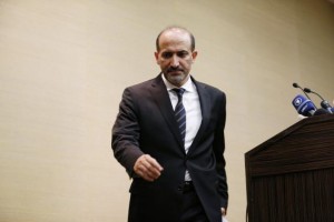 Syrian opposition leader Jarba leaves a news conference in Geneva