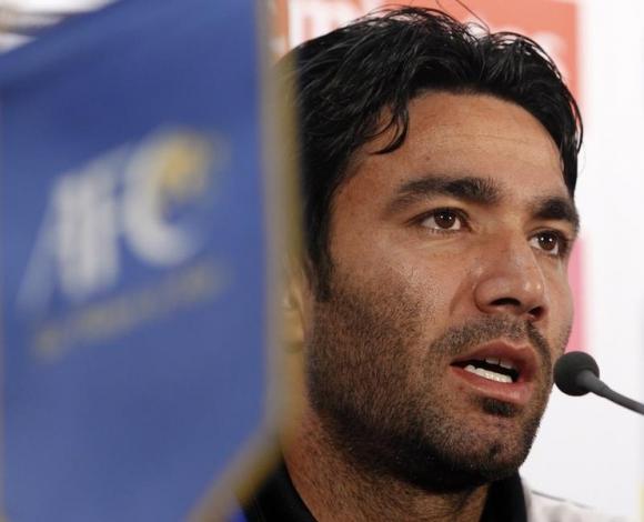 Iran's Nekounam speaks to the media during a pre-match news conference ahead of the quarter-final match against South Korea at the Asian Cup soccer tournament in Doha