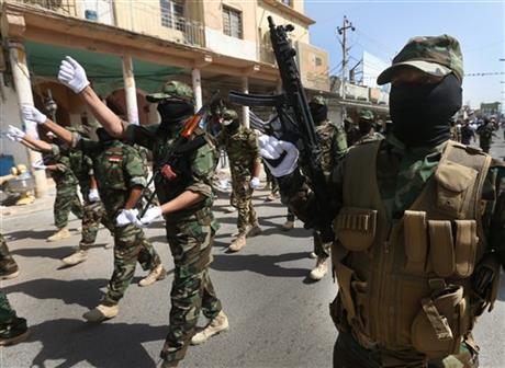 Iraqi armed Shiite militiamen,