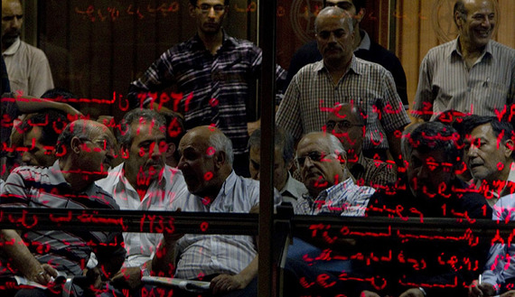 Investors look at an electronic display board reflected in a glass partition at the Tehran Stock Exchange, Sept. 15, 2010. (photo by REUTERS/Caren Firouz) Read more: http://www.al-monitor.com/pulse/originals/2014/06/iran-stock-market-needs-reform.html?utm_source=dlvr.it&utm_medium=twitter##ixzz3554j6Zkd