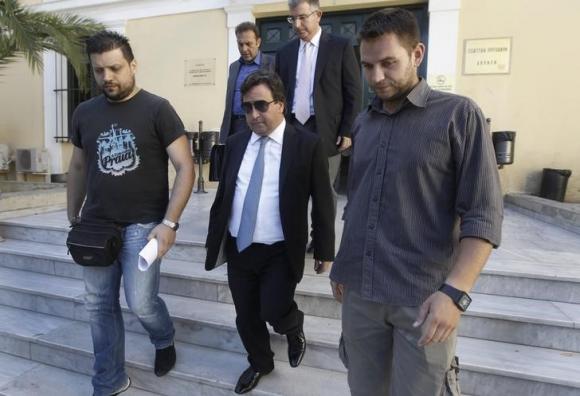 Greek shipowner Restis leaves a court in Athens