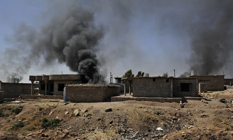 The homes of suspected Isis supporters are set ablaze in Zummar, northern Iraq.