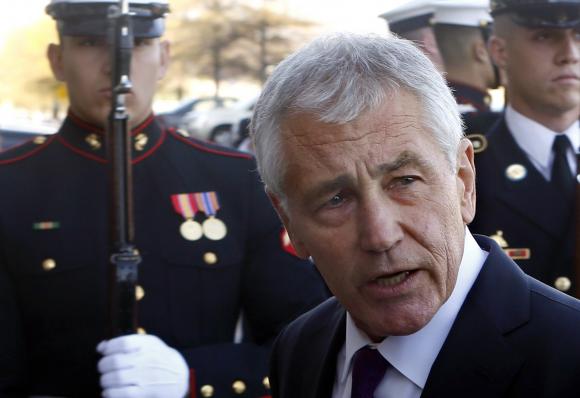 U.S. Secretary of Defense Chuck Hagel walks to the Pentagon in Washington