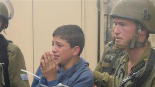 The file photo shows a Palestinian child arrested by the security forces of the Israeli regime.