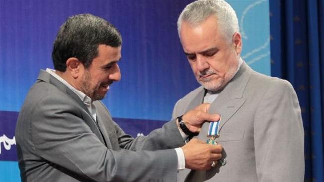Former Iranian President Mahmoud Ahmadinejad (L) and his deputy Mohammad Reza Rahimi