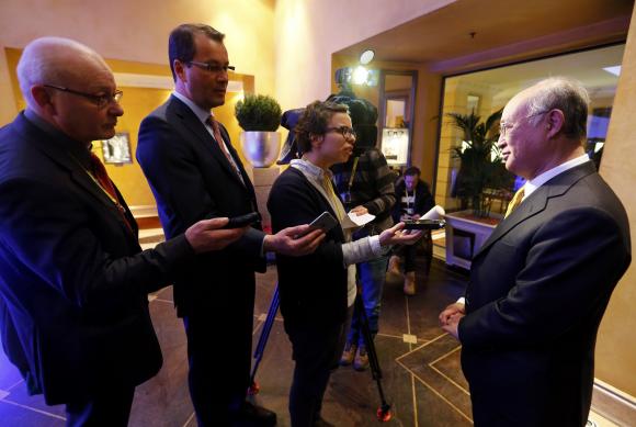 International Atomic Energy Agency (IAEA) Director General Yukiya Amano (R) talks with media during the 51st Munich Security Conference at the 'Bayerischer Hof' hotel in Munich February 7, 2015. CREDIT: REUTERS/MICHAEL DALDER