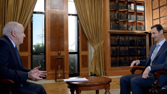 Syrian President Bashar al-Assad (R) giving an interview to the BBC in the capital Damascus on February 8, 2015 which was released by the Syrian Arab News Agency (SANA) on February 10, 2015.