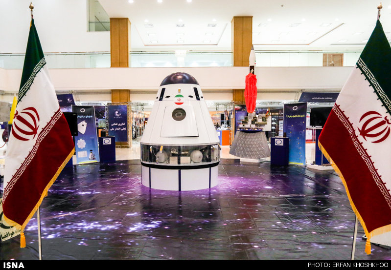Iran displays manned spacecraft, telecommunications satellite mockups in space expo on February 17, 2015.