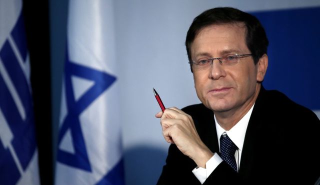 Israeli Labour party leader Isaac Herzog looks on during a political meeting in Tel Aviv, Dec. 14, 2014. Photo by AFP