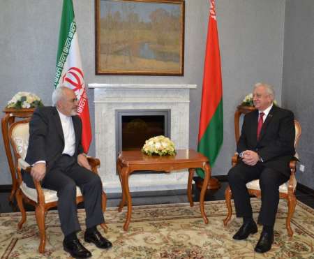 Speaker of the Upper House of Belarus Council of the Republic at the National Assembly Mikhail Myasnikovich meets Iran's FM Zarif in Minsk on February 17, 2015.