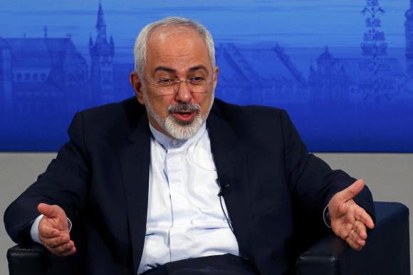 Iran's foreign minister Mohammad Javad Zarif gestures during an open debate at the 51st Munich Security Conference at the 'Bayerischer Hof' hotel in Munich February 8, 2015. CREDIT: REUTERS/MICHAEL DALDER