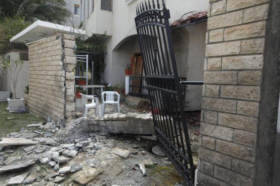 A general view of the damage caused by a bomb blast is seen at the gate of the Iranian ambassador's residence in Tripoli February 22, 2015. CREDIT: REUTERS/ISMAIL ZITOUNY