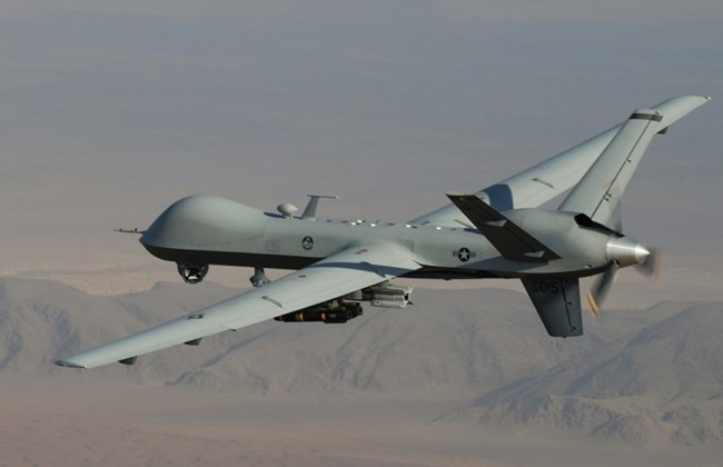 In this photo provided by the U.S. Air Force, an MQ-9 Reaper, armed with GBU-12 Paveway II laser guided munitions and AGM-114 Hellfire missiles, is piloted by Col. Lex Turner during a combat mission over southern Afghanistan.(AP Photo/Lt. Col.. Leslie Pratt, US Air Force)