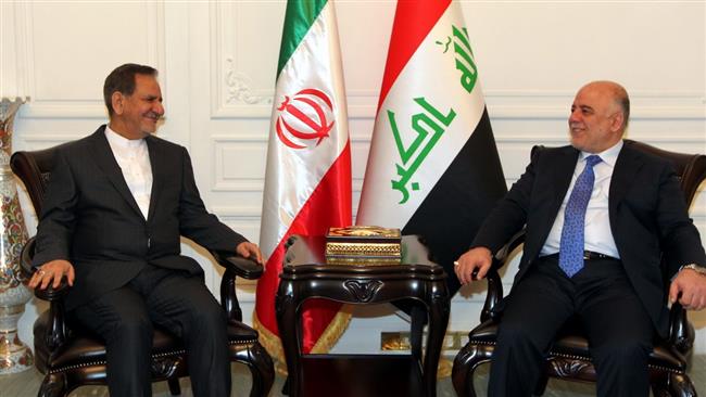 Iranian First Vice President Eshaq Jahangiri (L) and Iraqi Prime Minister Haider al-Abadi meet in Baghdad on February 16, 2015.