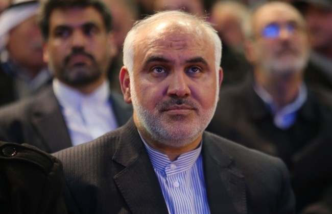 Iranian ambassador to Lebanon Mohammad Fathali listens to Hezbollah leader Hasan Nasrallah in Beirut's southern suburbs, Friday, Jan. 30, 2015.