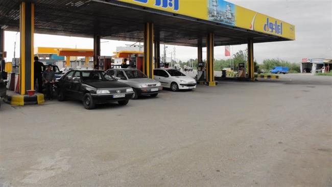 This file photo shows cars gassing up at a petrol station near Tehran.