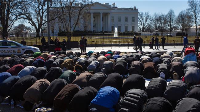 Protesters gathered to pray outside the White House on Friday in response to the killing of three Muslim students in North Carolina on Tuesday.
