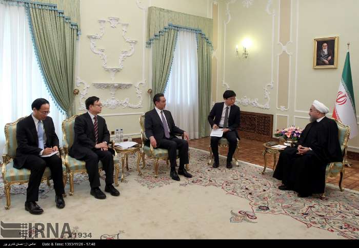 Chinese Foreign Minister Wang Yi meets Iranian president Rouhani in Tehran on February 15, 2015.