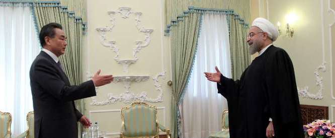 Chinese Foreign Minister Wang Yi meets Iranian president Rouhani in Tehran on February 15, 2015.