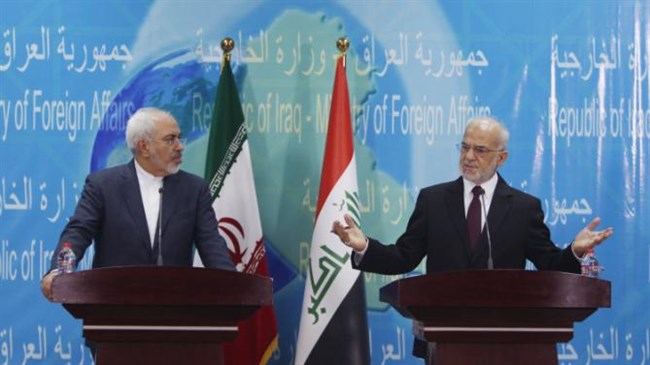 Iranian Foreign Minister Mohammad Javad Zarif (L) during a press conference with Iraqi Foreign Minister Ibrahim al-Jaafari in the Iraqi capital Baghdad on February 24, 2015.