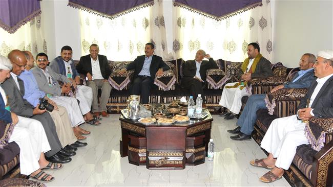Former Yemeni Prime Minister Khalid Bahah (C-L) sits with ex-Foreign Minister Abdullah Al-Saidi (C-R) and aides at his house in Sanaa on March 16, 2015 after the Ansarullah movement agreed to free him and all his cabinet ministers after nearly two months of house arrest.