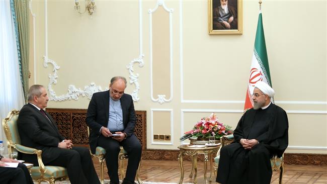 Iranian President Hassan Rouhani (R) meets Jordanian Foreign Minister Nasser Judeh in the Iranian capital, Tehran, on March 7, 2015.