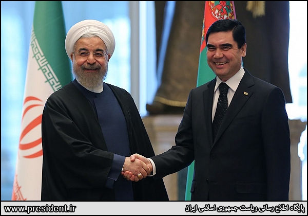 ran's President Rouhani shakes hands with Turkmen President Kurbanguly Berdymukhamedov in Ashgabat on March 11, 2015.