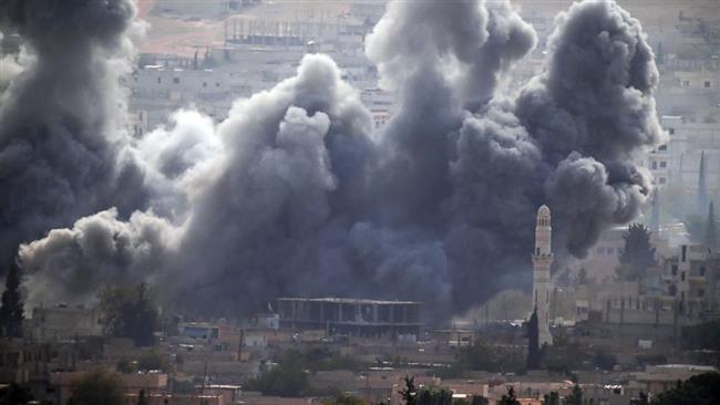 This file photo shows thick smoke rising following an airstrike by the US-led coalition in the town of Kobani in Syria. AP