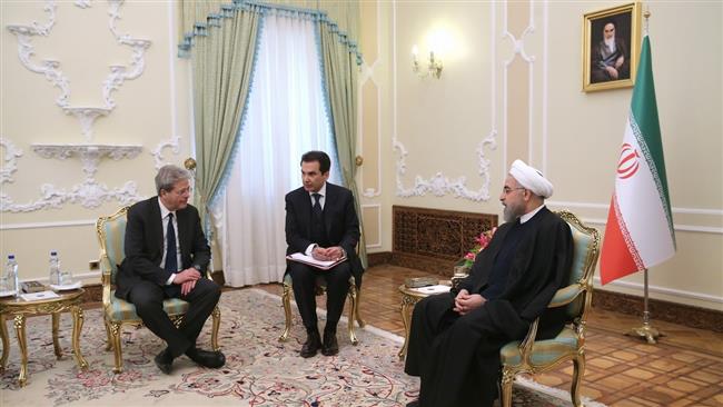 Irans President Hassan Rouhani (R) and Italys Foreign Minister Paolo Gentiloni meet in Tehran on March 1, 2015.
