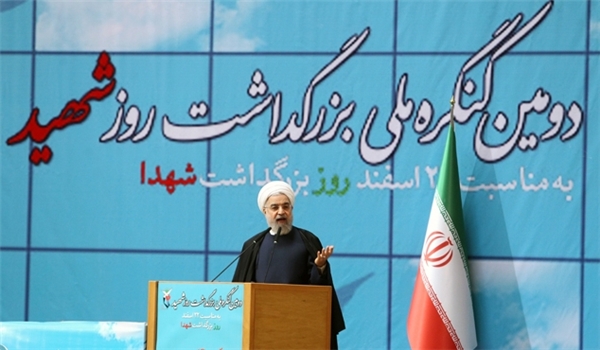 Iran's president Hassan Rouhani addresses second congress of Martyrs Day in Tehran on March 9, 2015.